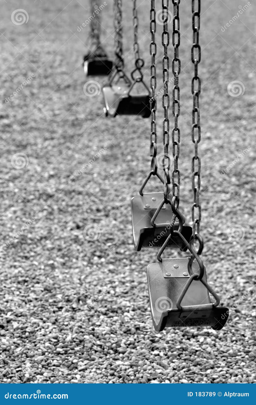 playground swings in black and white