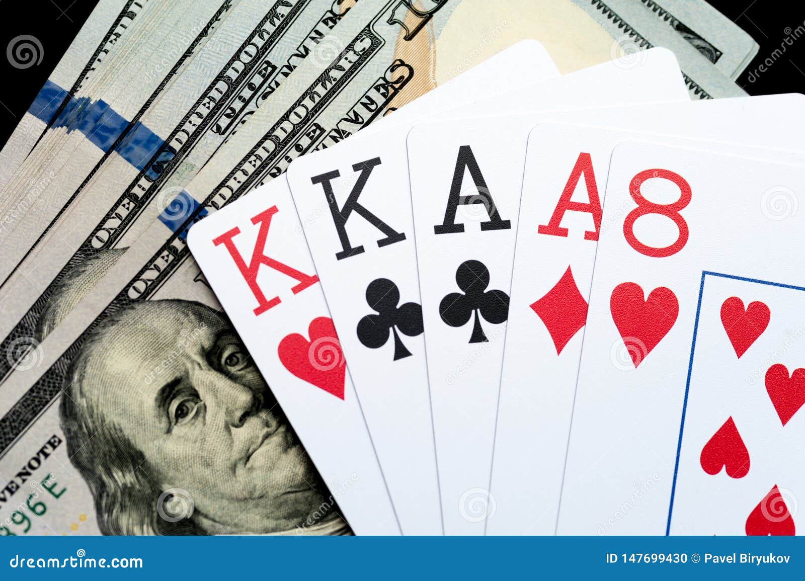 Playing Cards and Stack of American Dollars Bills. Stock Photo Image