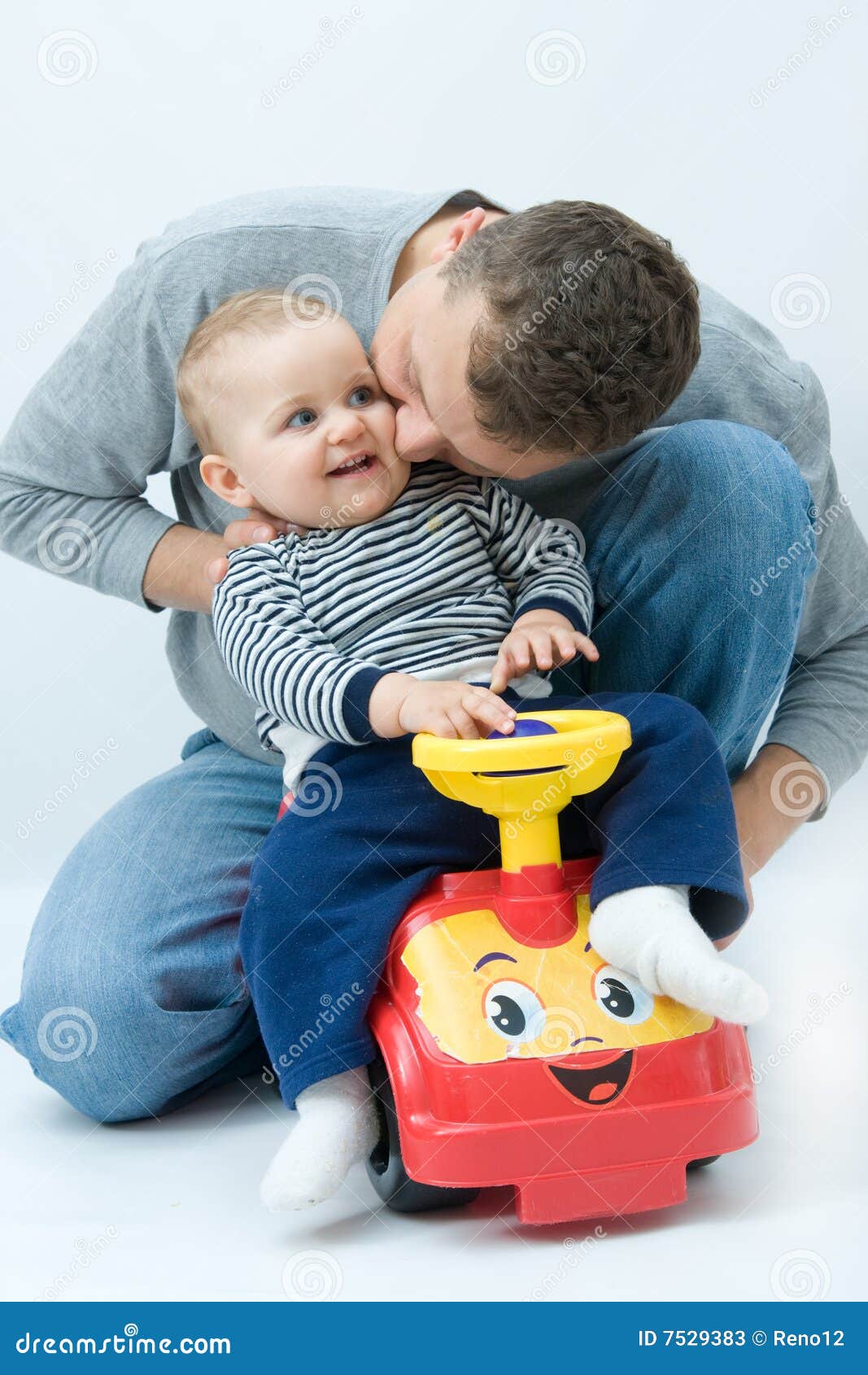 Playing with father. Young father playing with his son, on bright background