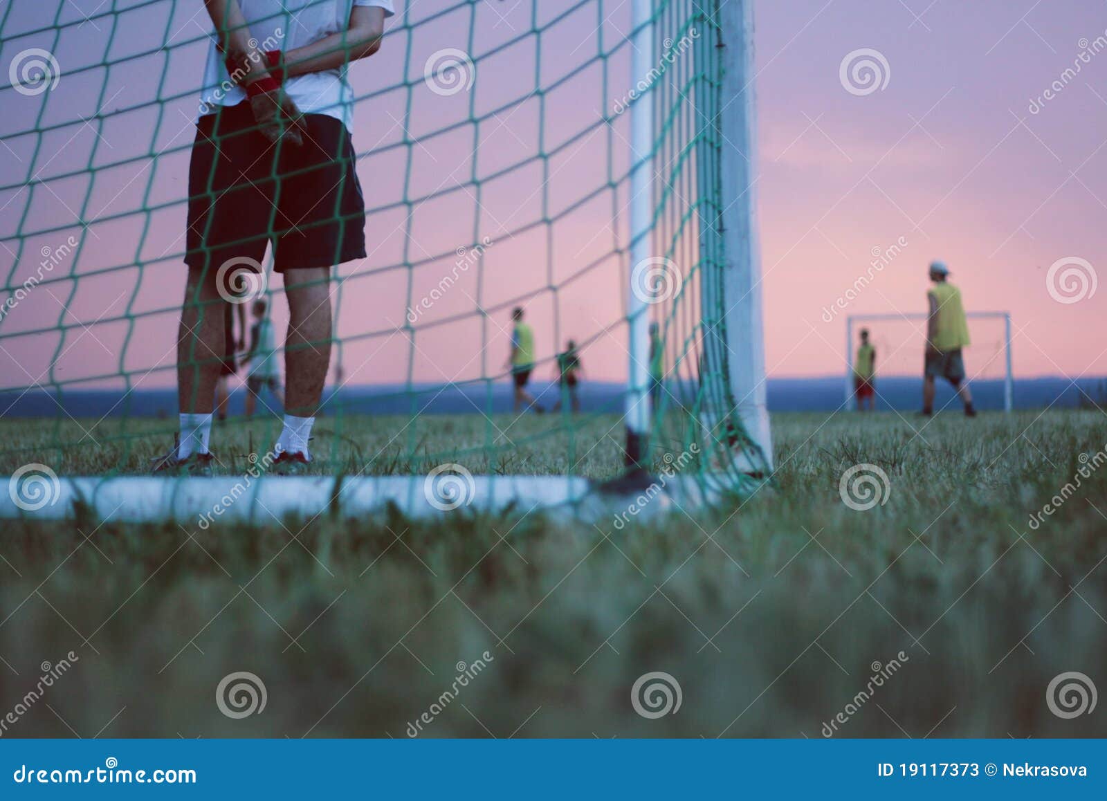 Playing Football in a Field at Sunset Stock Image Image of youth