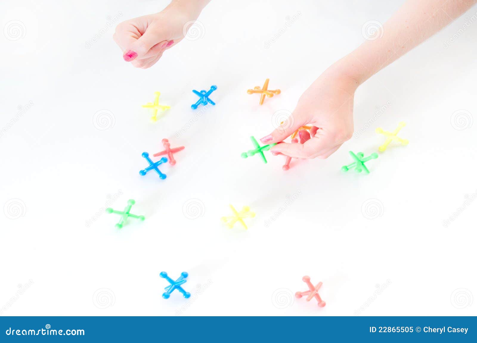 Playing game of jacks stock image. Image of action, pieces 22865505
