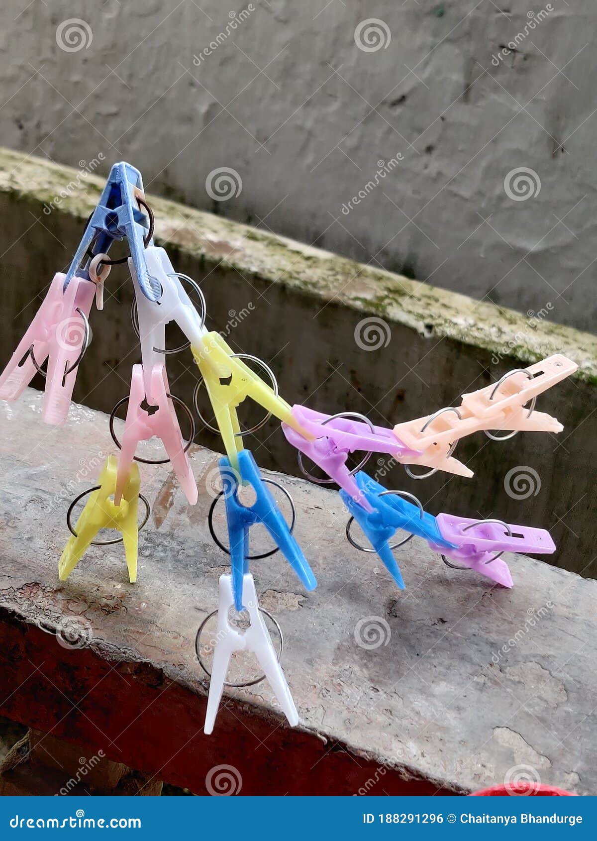 Playing Games with the Clothing Pegs. Stock Photo Image of person