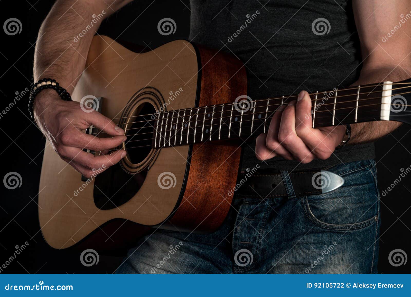 Playing Guitar. Acoustic Guitar in the Hands of the Guitarist