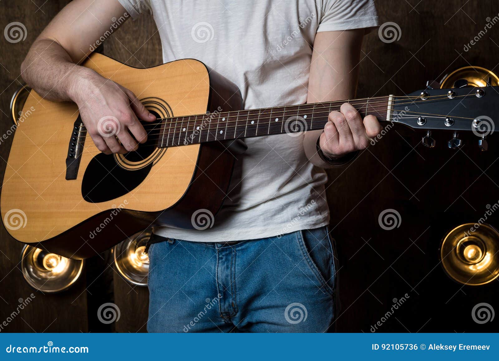 Playing Guitar. Acoustic Guitar in the Hands of the Guitarist