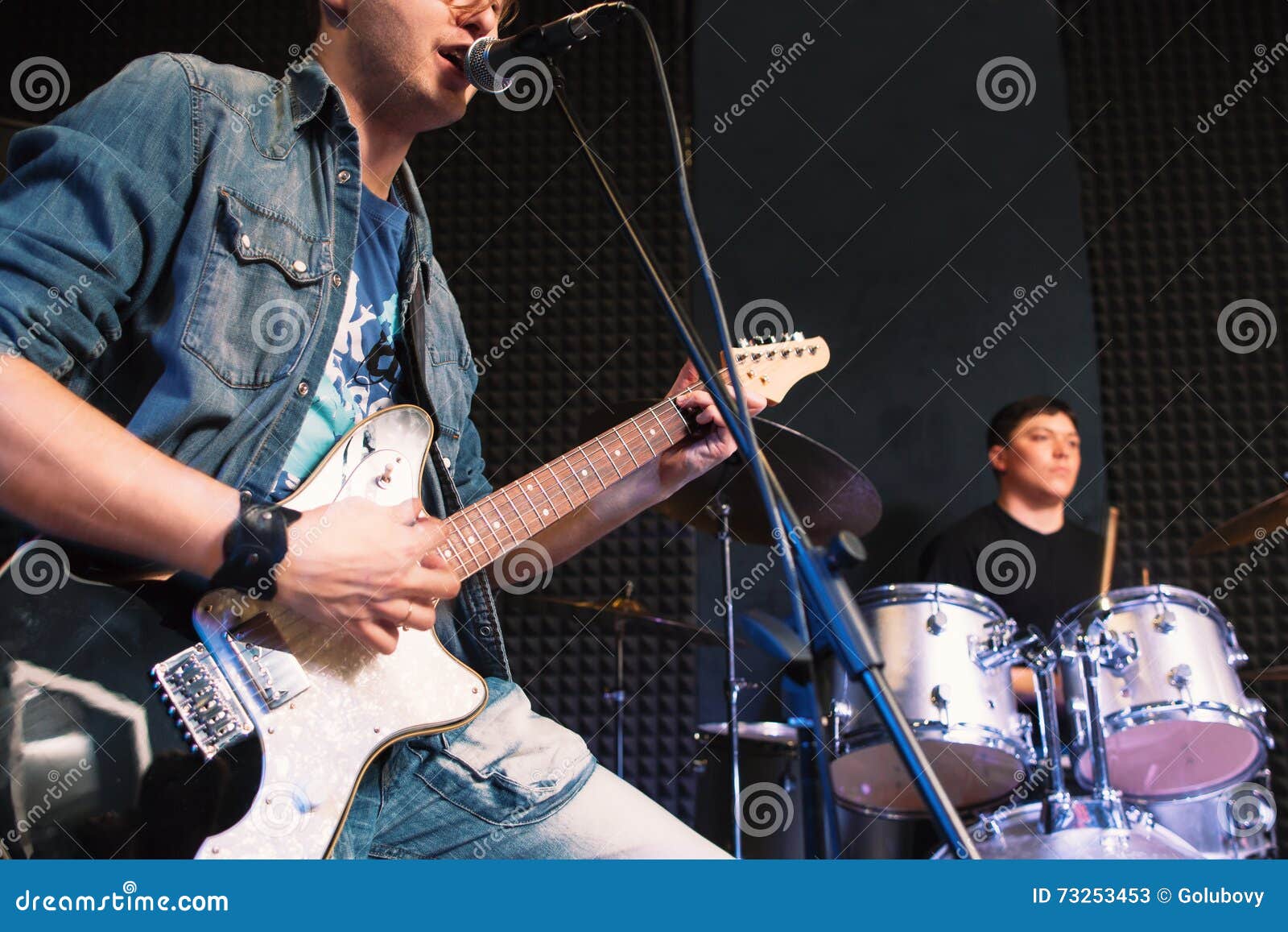 Playing on Guitar Vocalist and Drummer Stock Image Image of sing