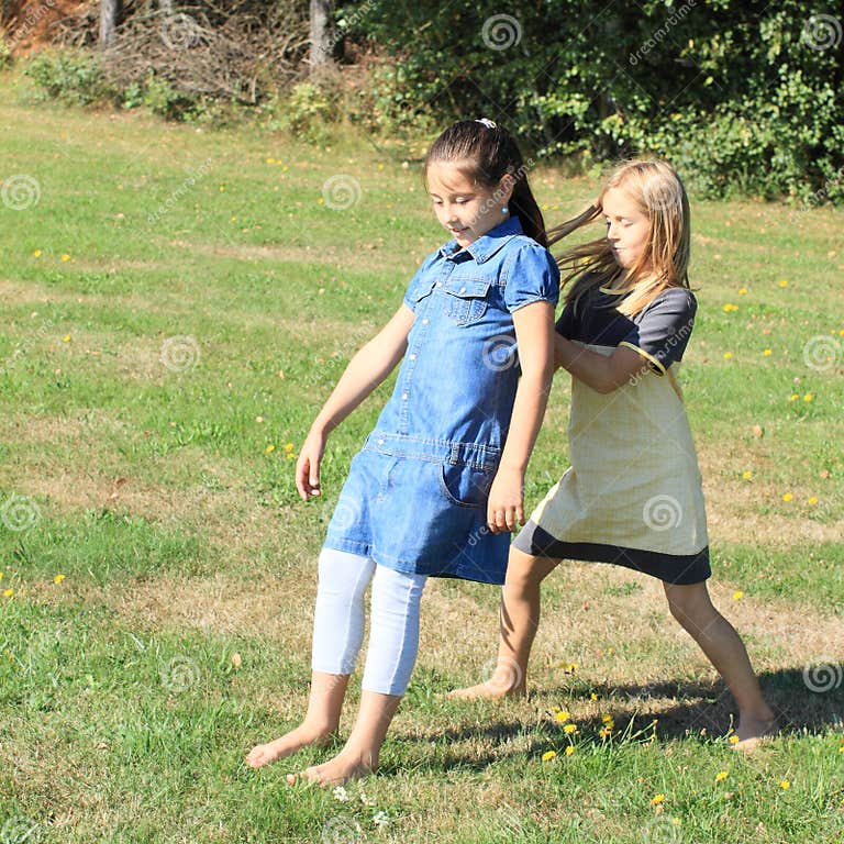 Playing kids stock image. Image of barefoot, blue, dresses - 33462061