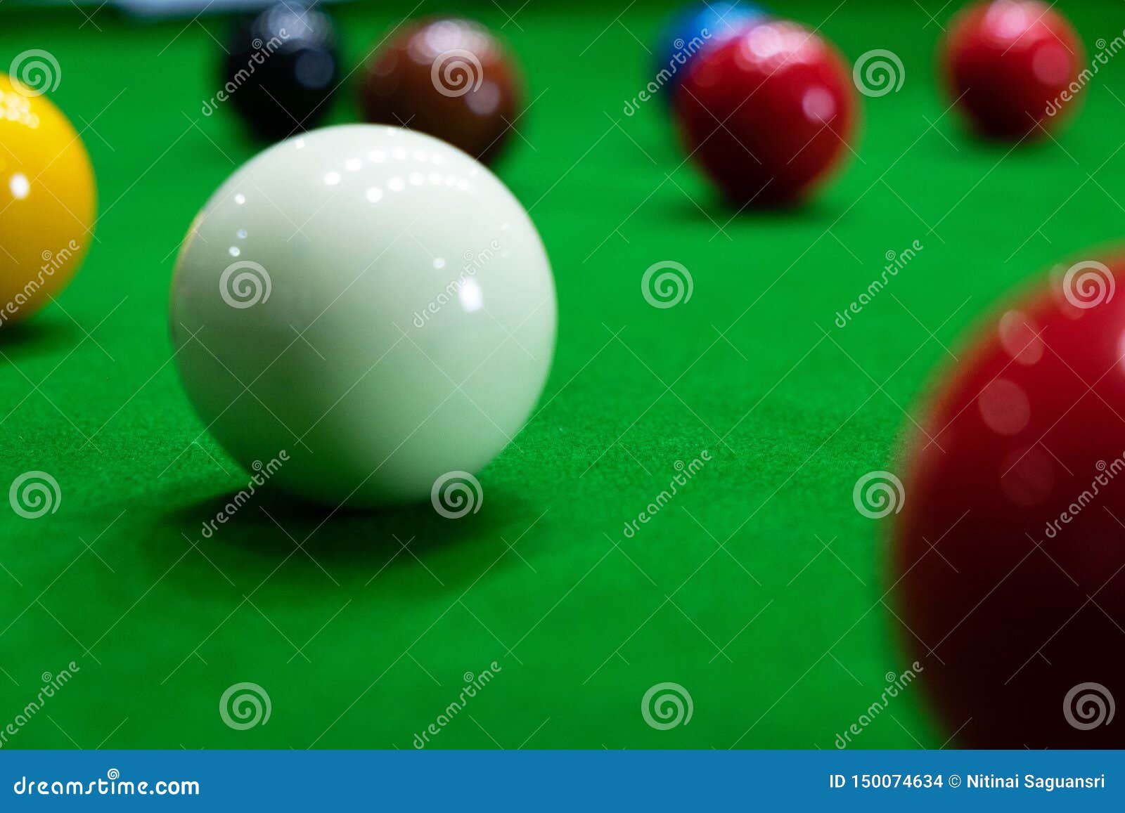 Playing Snooker, Piercing the Red Ball, Black, Aiming the Ball and Pocketing the Hole To Score Points Stock Photo