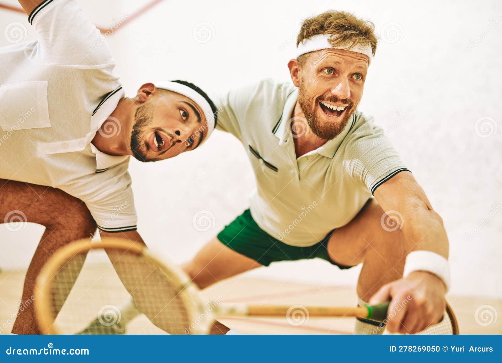 Playing Squash Serves Up a Serious Cardio Workout. Two Young Men