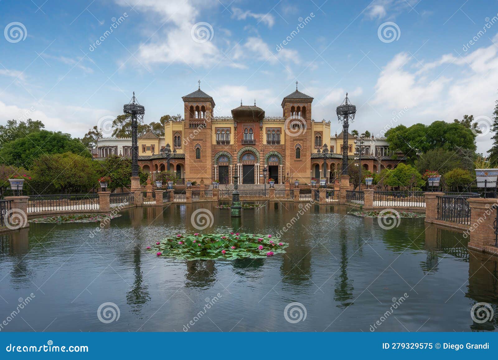 plaza de america central pond and mudejar pavilion at maria luisa park - seville, andalusia, spain