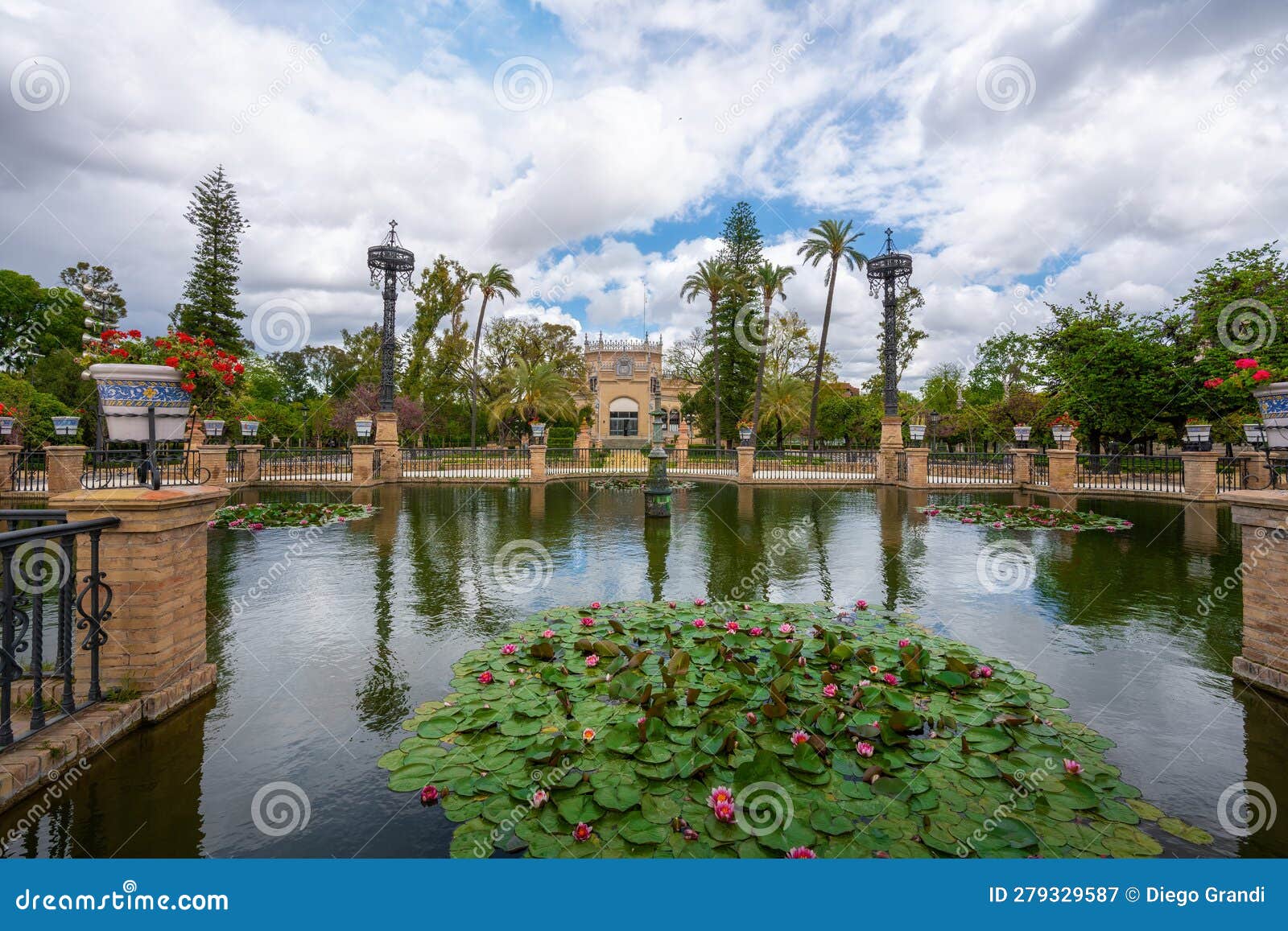 plaza de america central pond and royal pavilion (pabellon real) at maria luisa park - seville, andalusia, spain