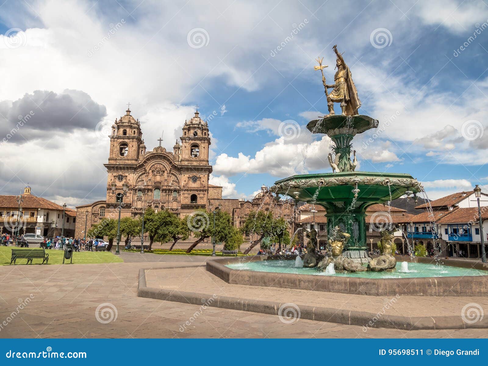 plaza de armas with inca fountain and compania de jesus church - cusco, peru