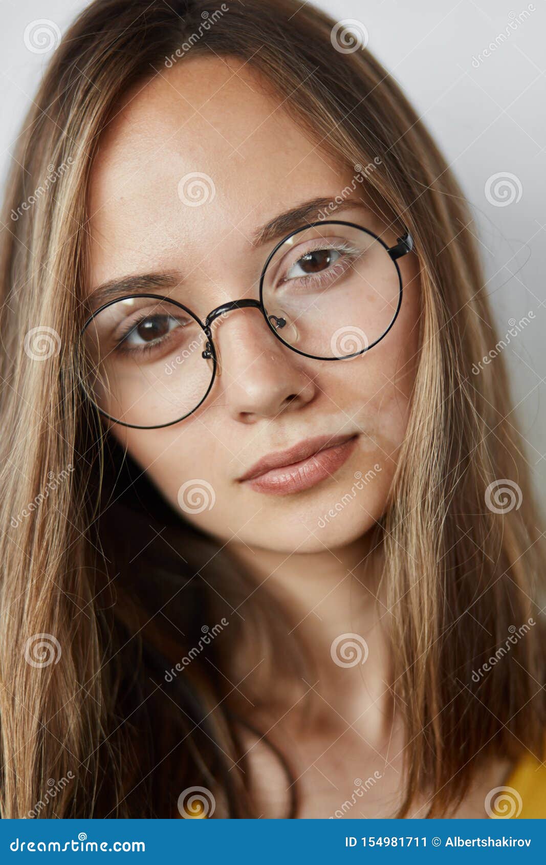 Pleasant Good Loking Girl Wearing Stylish Round Glasses Stock Image