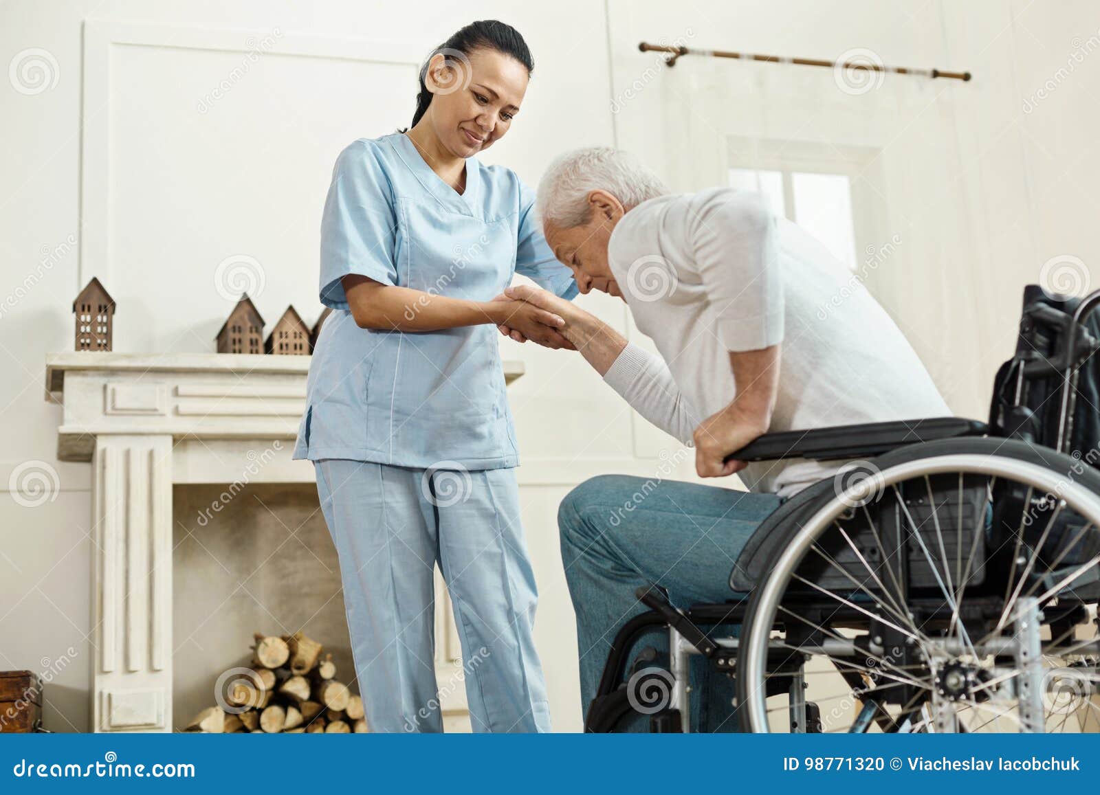 pleasant senior man holding caregivers hand