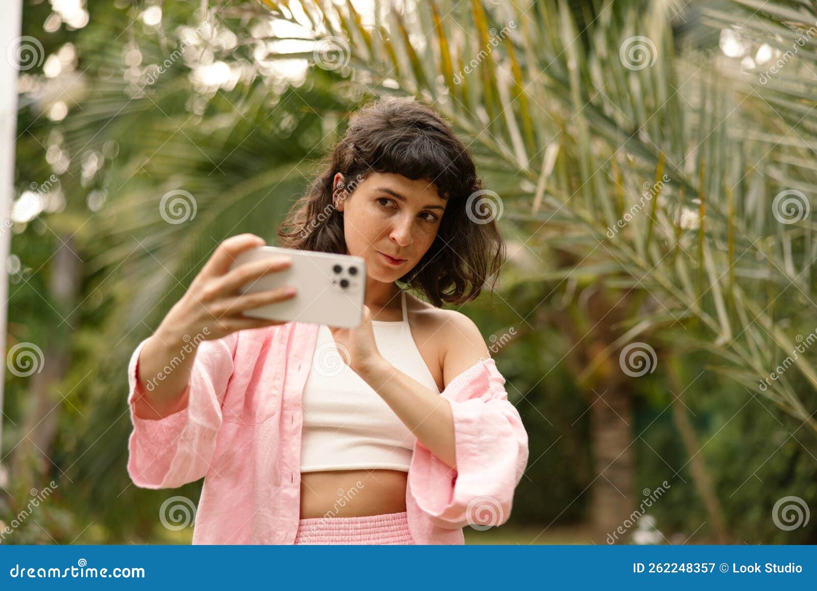 Pleasant Young Caucasian Girl Takes Selfie On Modern Smartphone Walking Outdoors Stock Image 