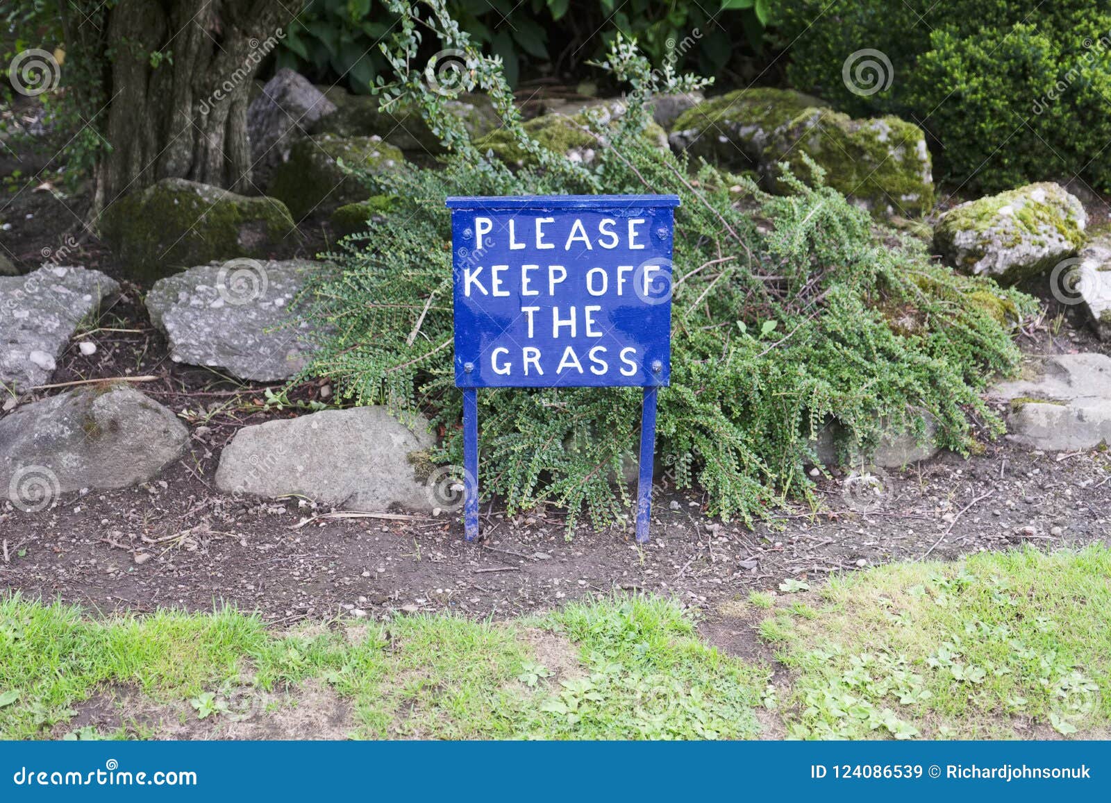 Please Keep Off Grass Blue Sign In Private Garden Stock Image