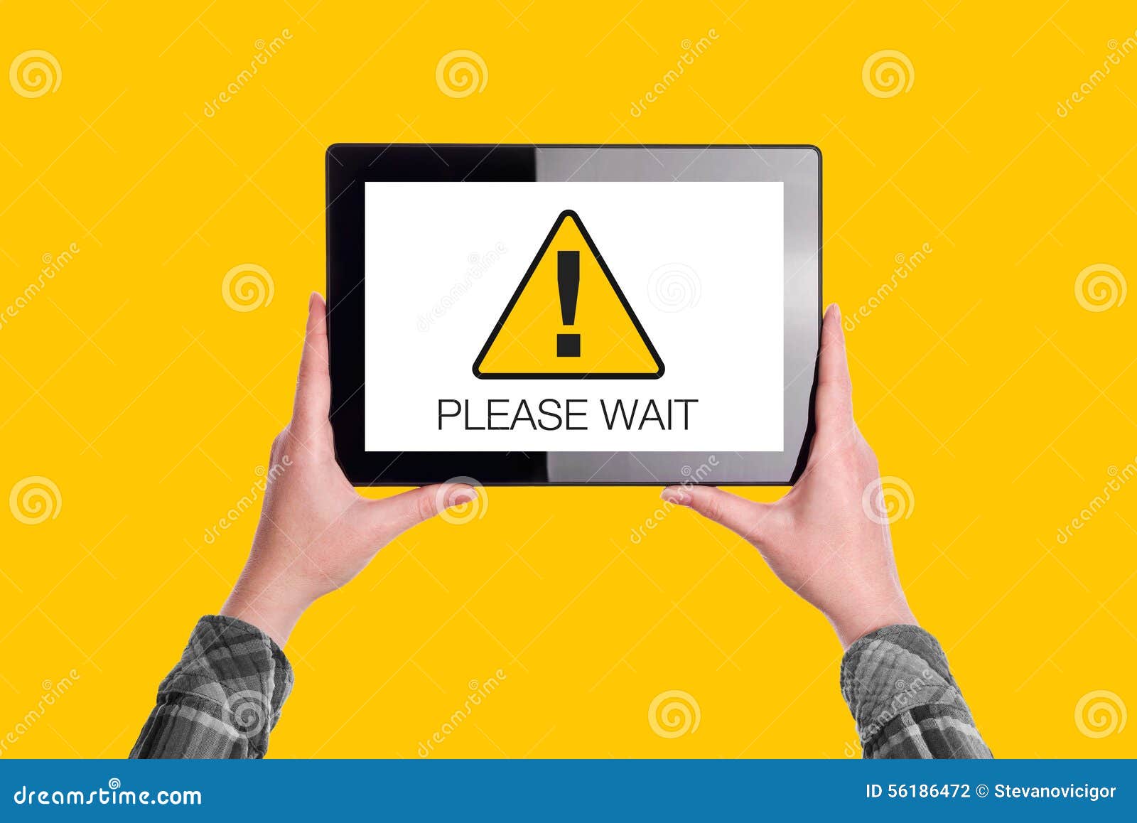 please wait message on digital tablet computer display