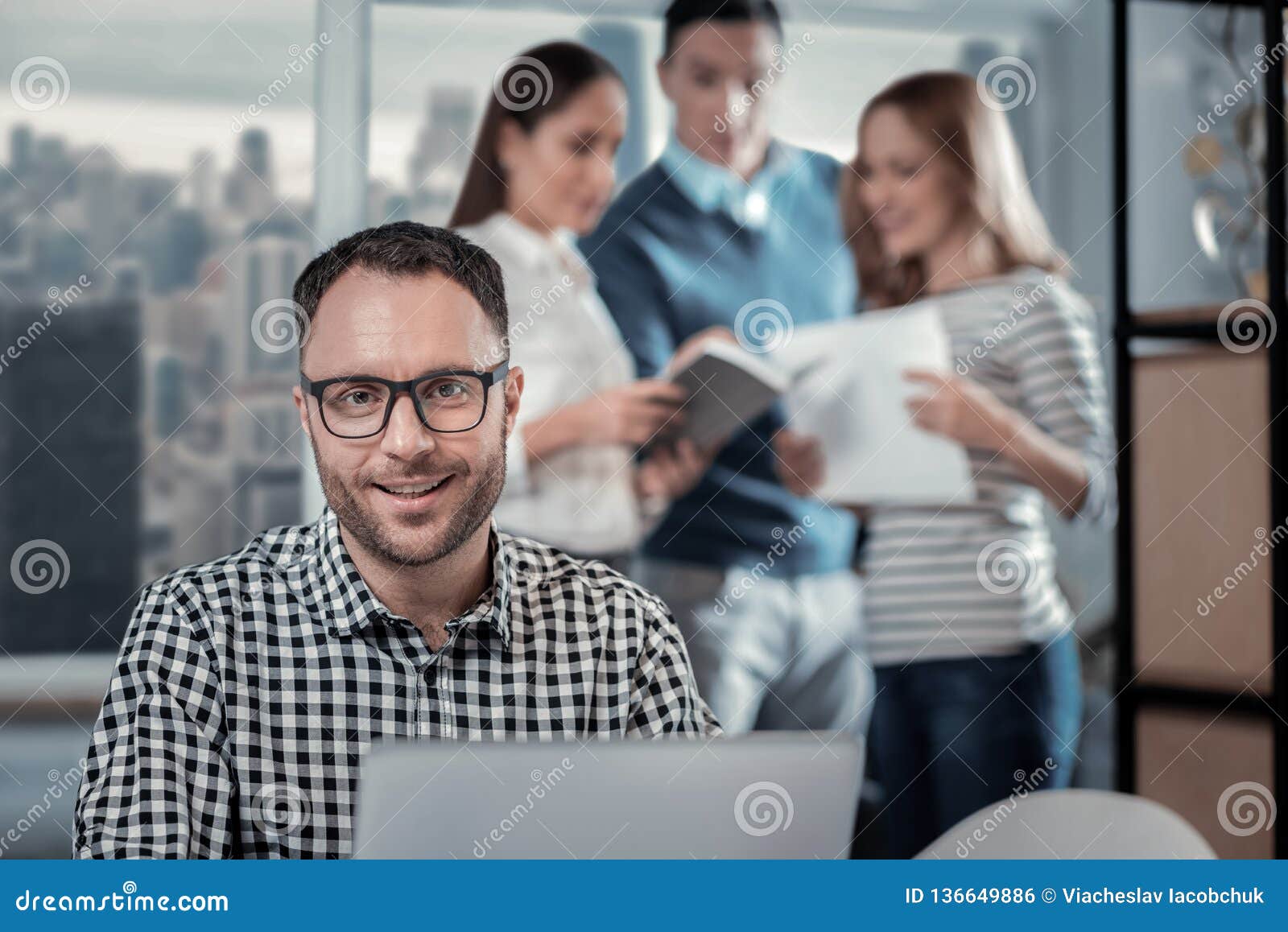 Pleased Man Working On His Laptop At Work Stock Photo - Image of ...