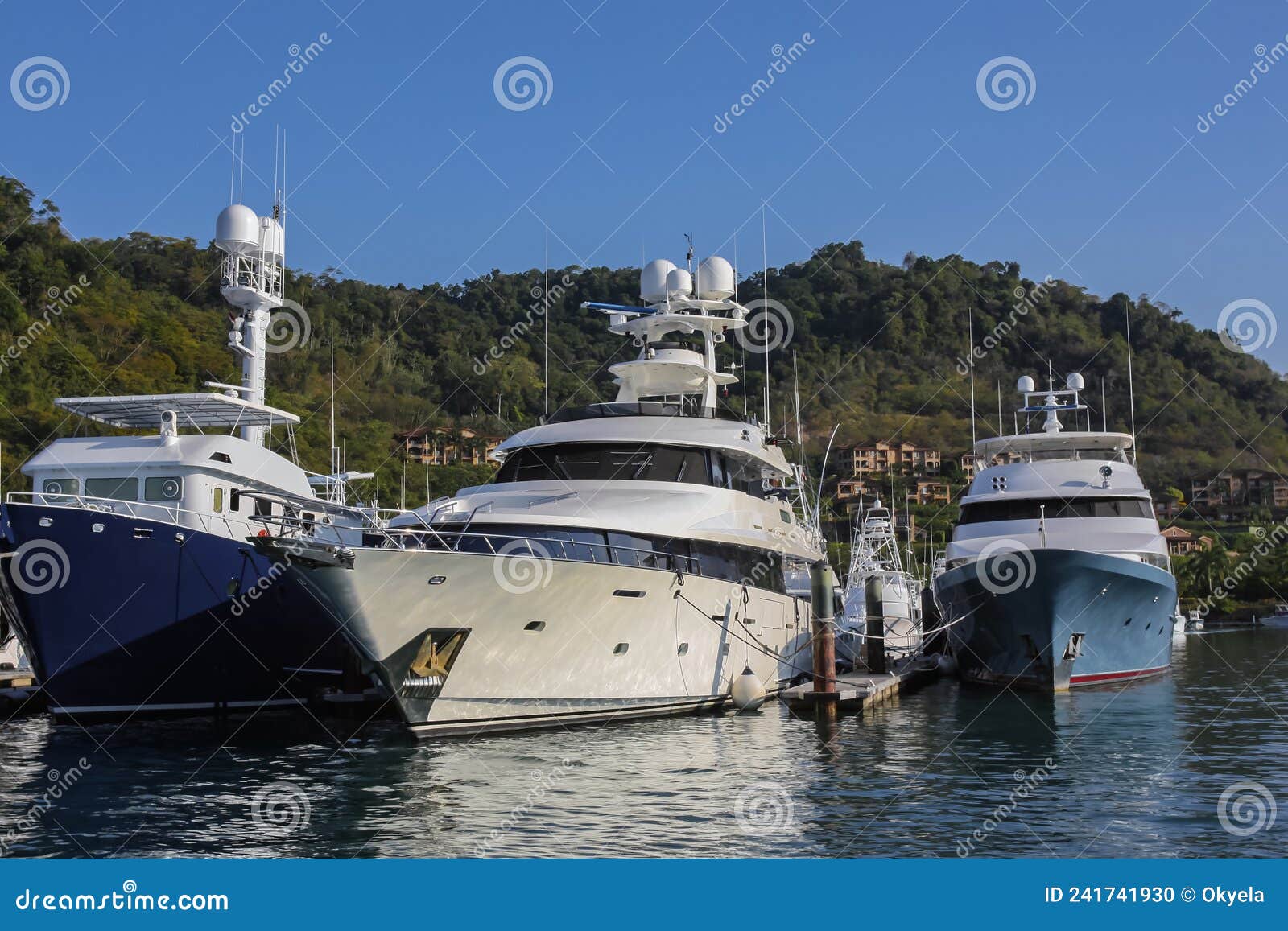 pleasure and tourist yachts in the parking lot in bay on the oceanic coast in a central american country