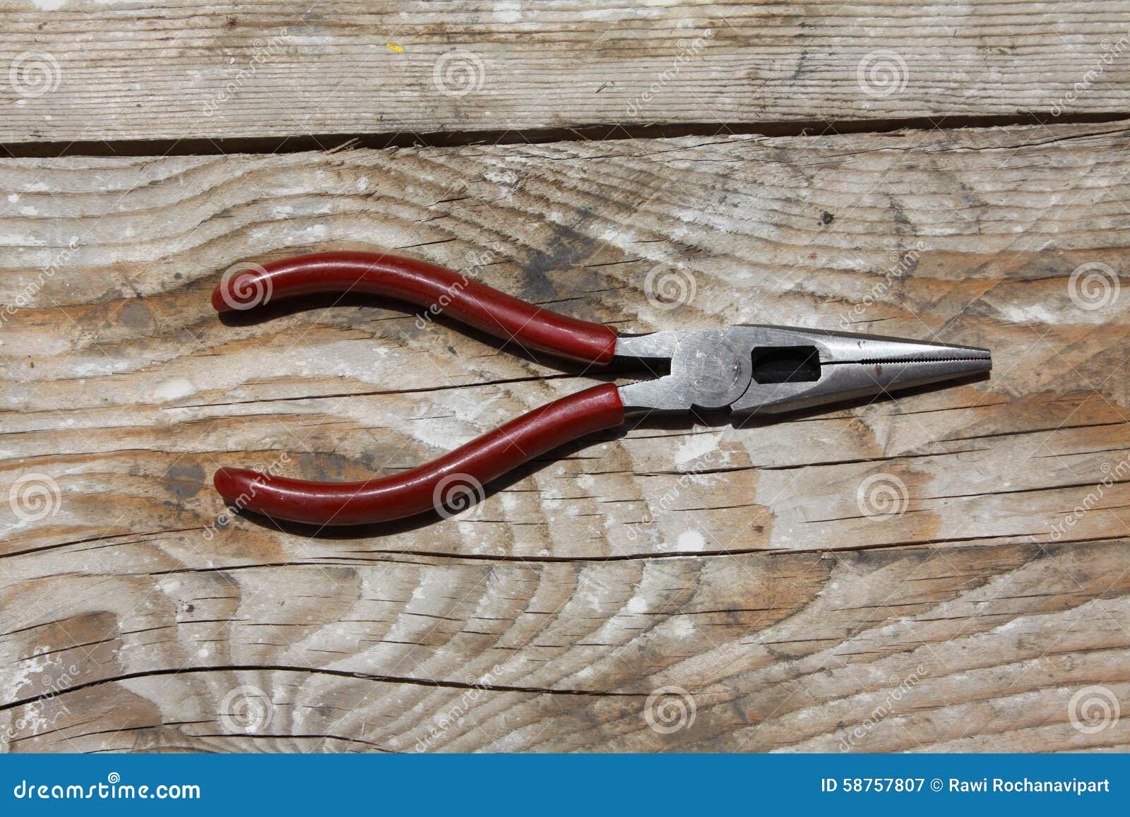 Pliers on wooden table stock image. Image of work, handle 58757807
