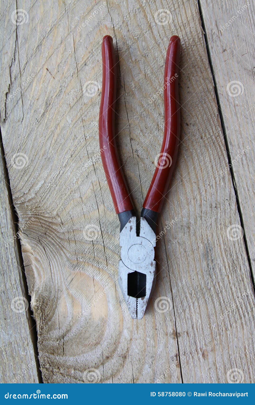 Pliers on wooden table stock photo. Image of tighten 58758080
