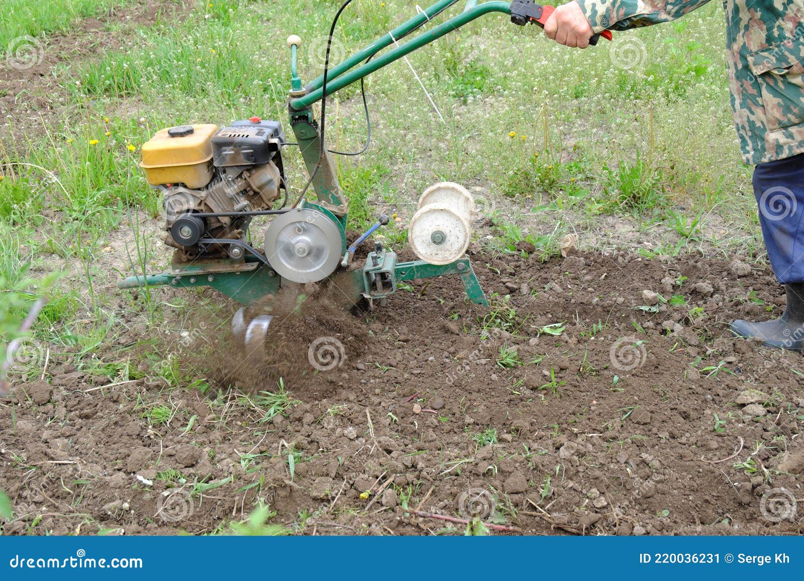 Plowing a Plot for Gardening with a Gasoline Cultivator with Special