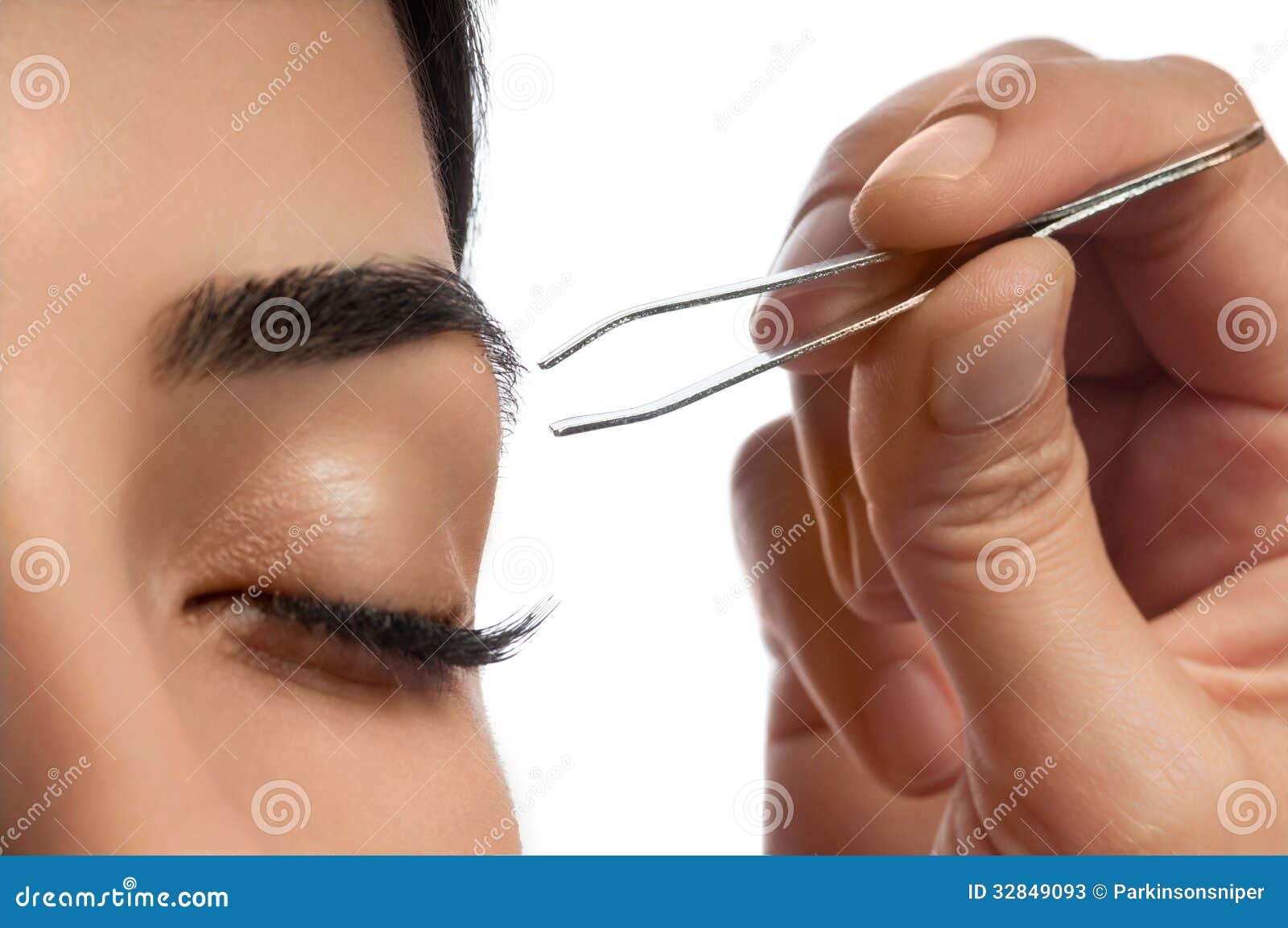 plucking eyebrow