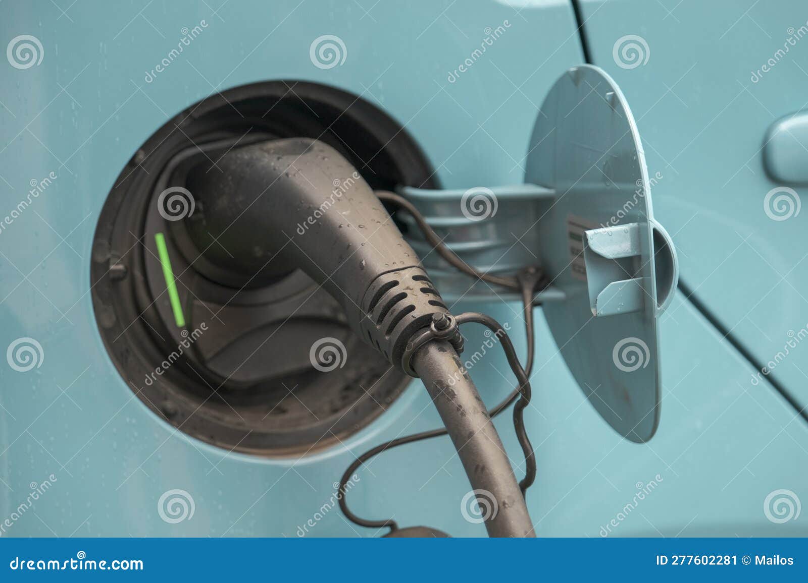 Plug in of an electric car stock image. Image of plug 277602281