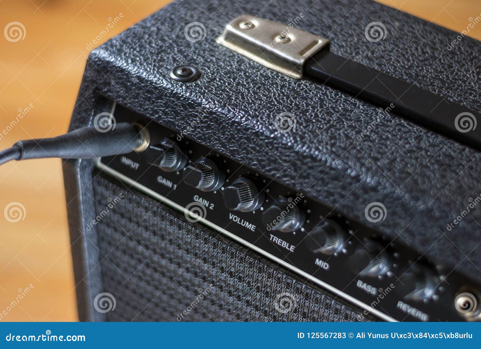 Plugged guitar and amp stock image. Image of entertainment 125567283