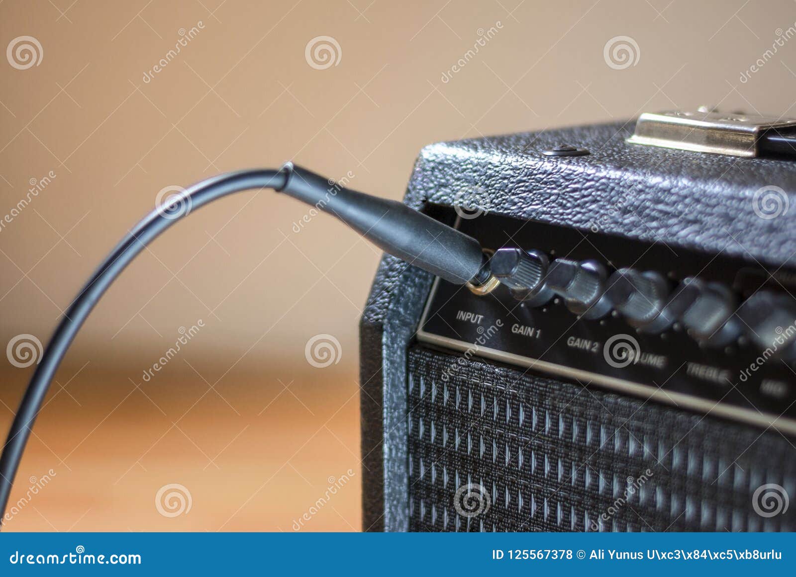 Plugged guitar and amp stock photo. Image of guitar 125567378