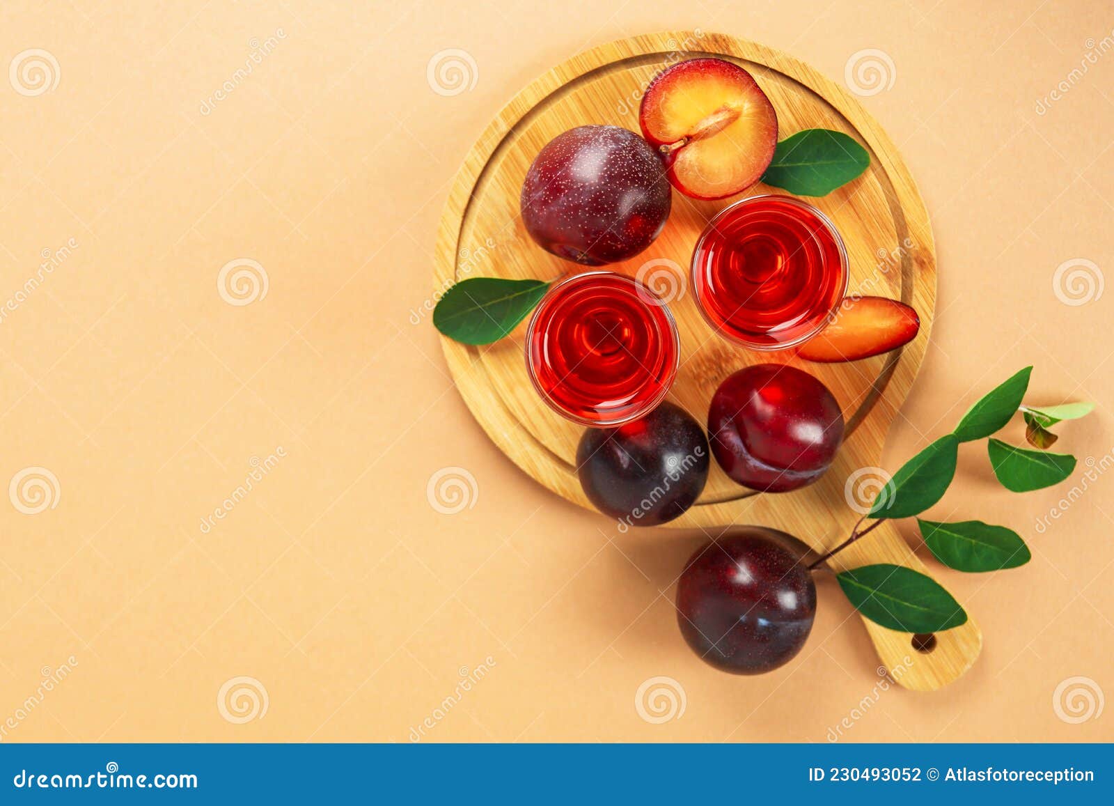Plum Brandy Shots and Ingredients on Beige Background Stock Photo