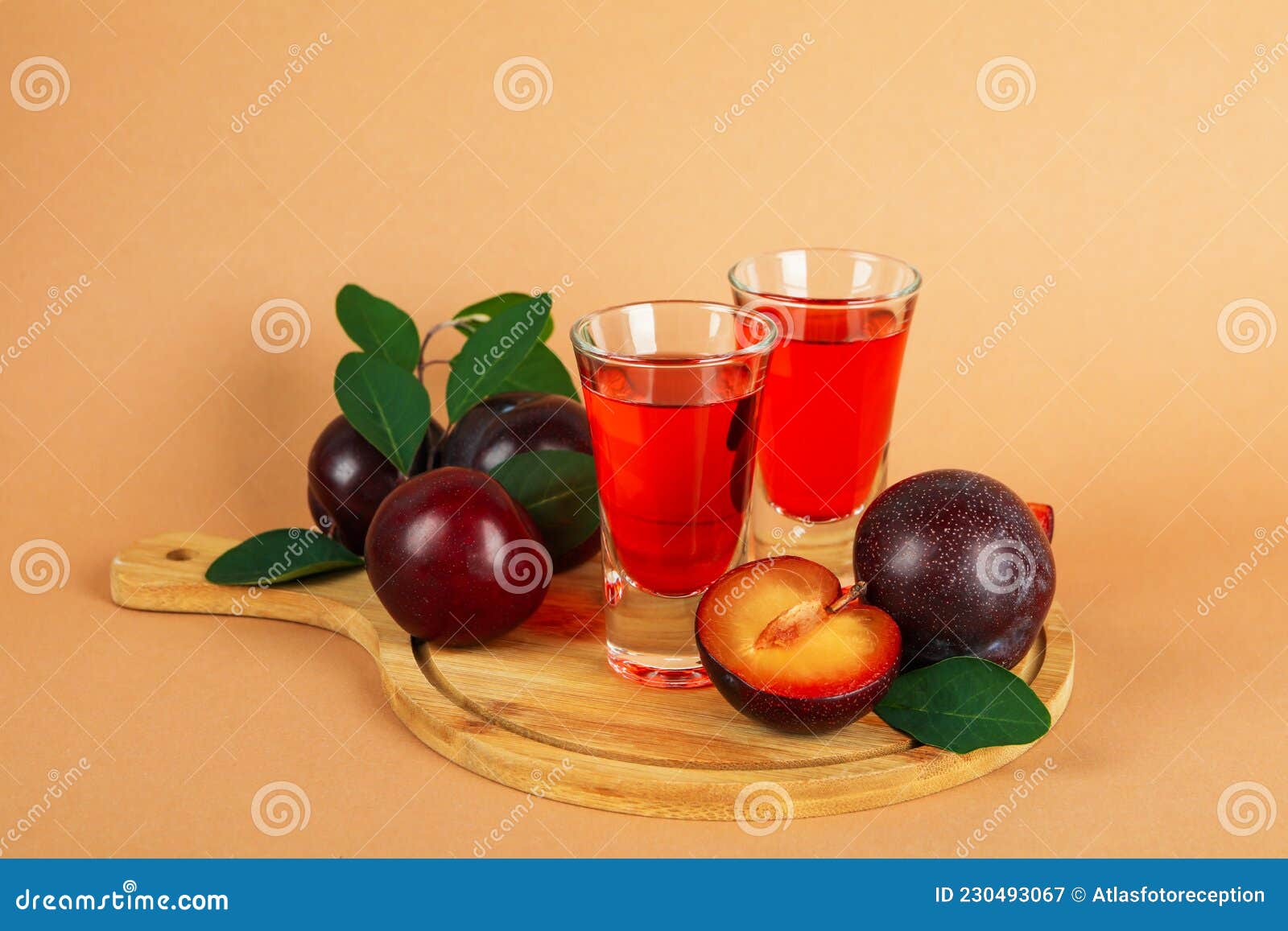 Plum Brandy Shots and Ingredients on Beige Background Stock Image