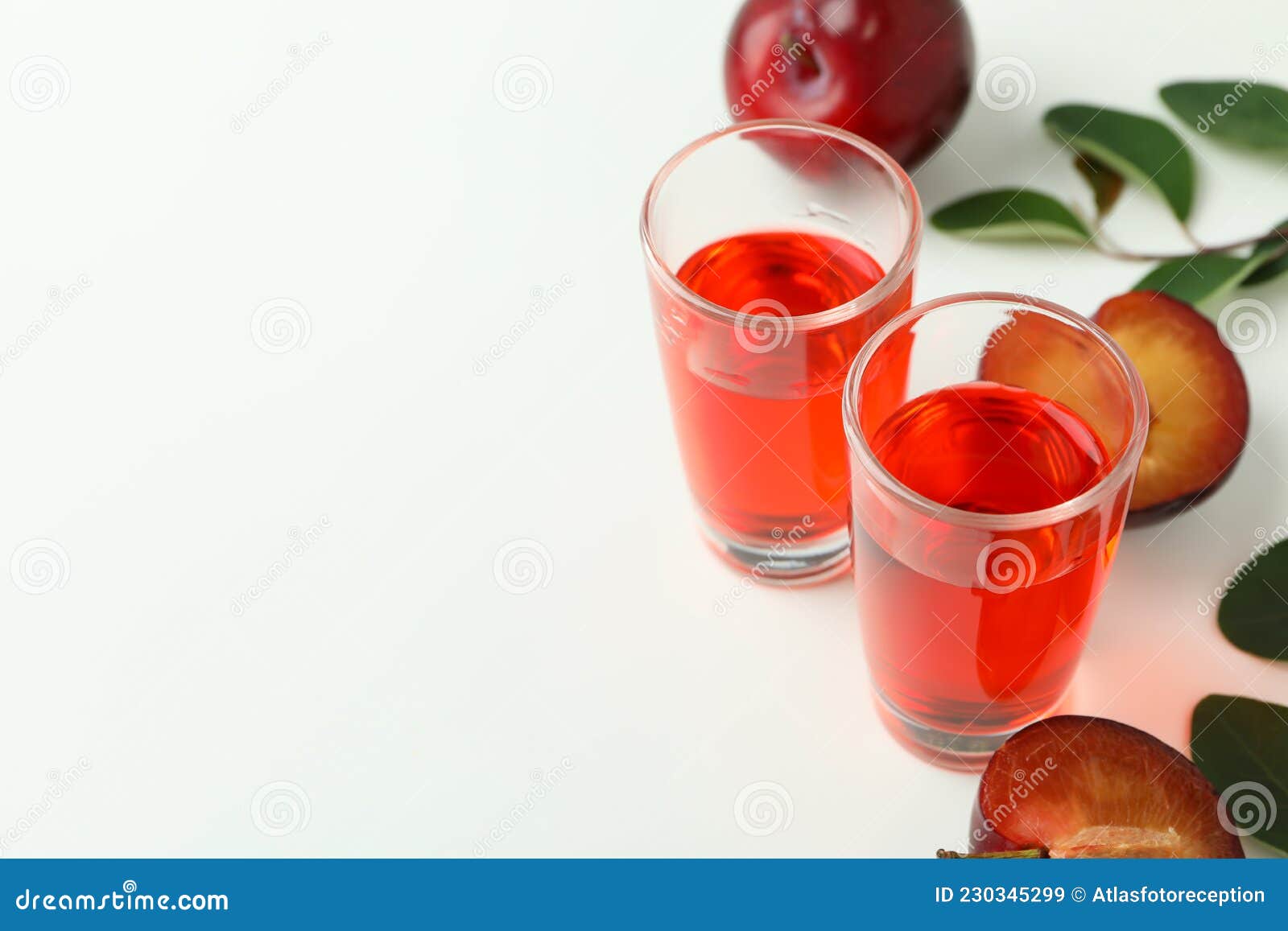 Plum Brandy Shots and Ingredients on White Background Stock Image