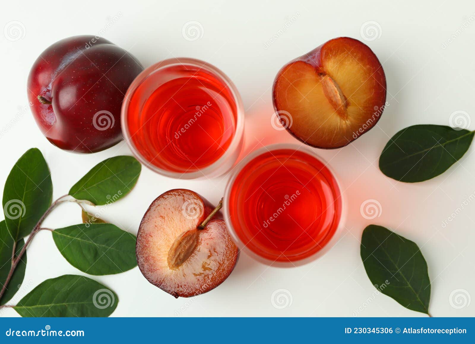 Plum Brandy Shots and Ingredients on White Background Stock Photo
