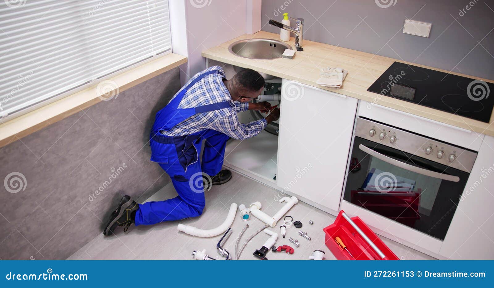 Plumber Cleaning Kitchen Drain and Pipe Stock Image Image of plumb