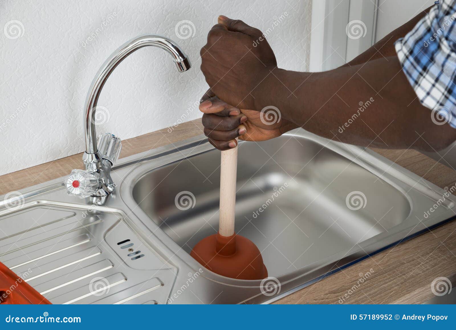 Woman Cleaning Bathroom Sink Drain Using Plunger. Stock Photo, Picture and  Royalty Free Image. Image 176038405.