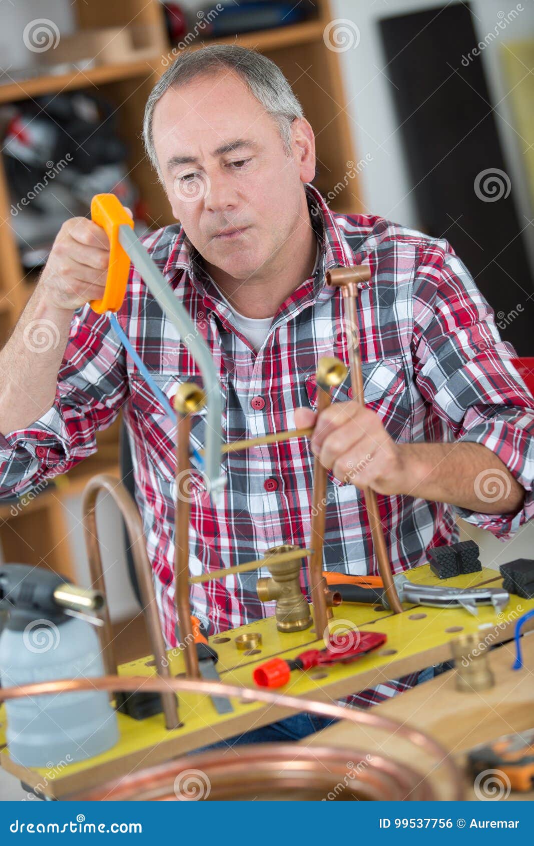 Plumber Cutting Cooper Pipes with Saw Stock Photo Image of