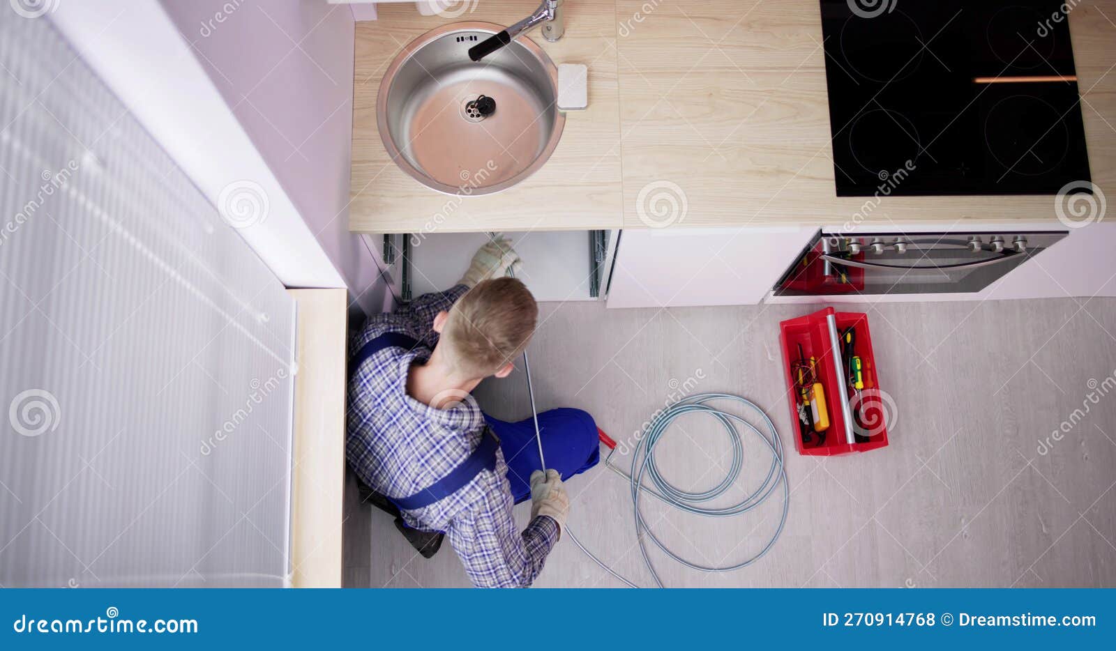 Plumber Drain Cleaning Services in Kitchen Stock Photo Image of