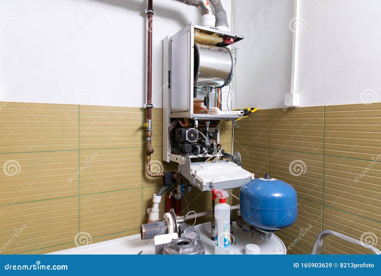 Plumber Fixing Central Heating System, Worker Servicing a Gas Boiler
