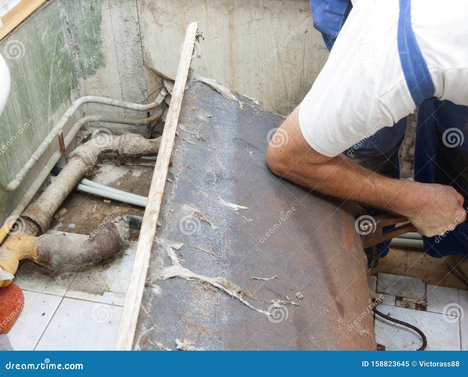 Plumber fixing old bath stock image. Image of bath, floor 158823645