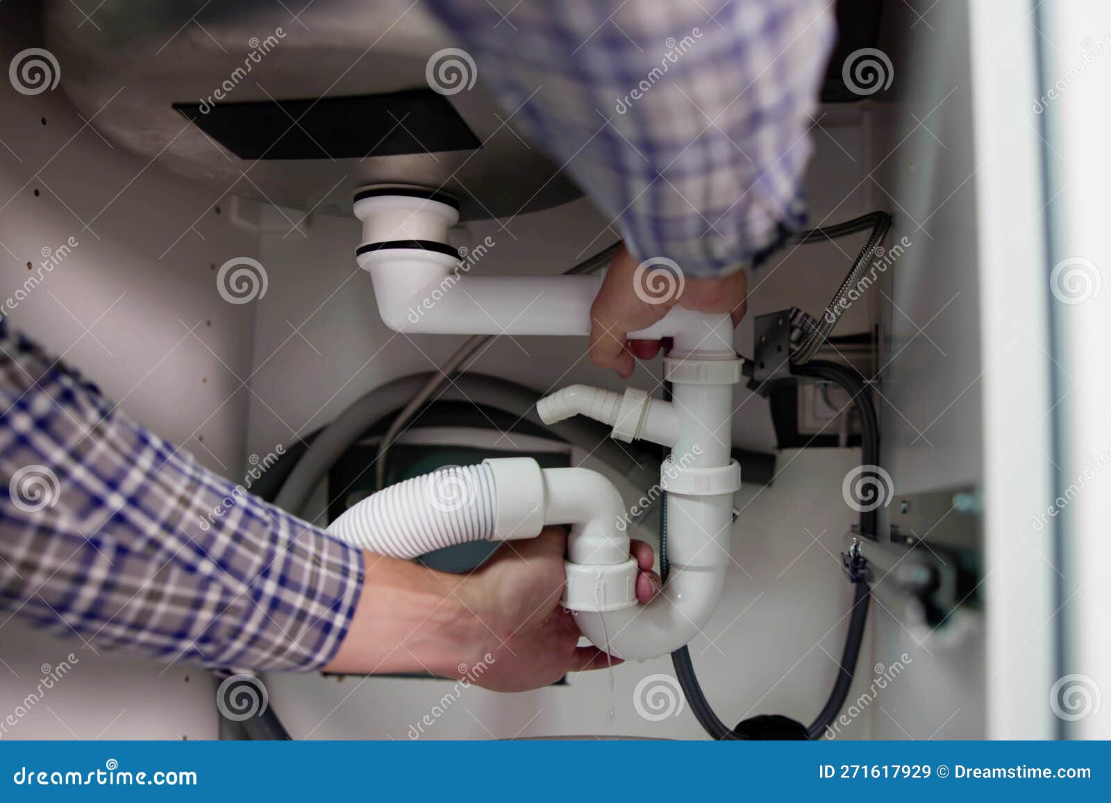 Plumber Fixing Pipe Leak stock image. Image of sink 271617929