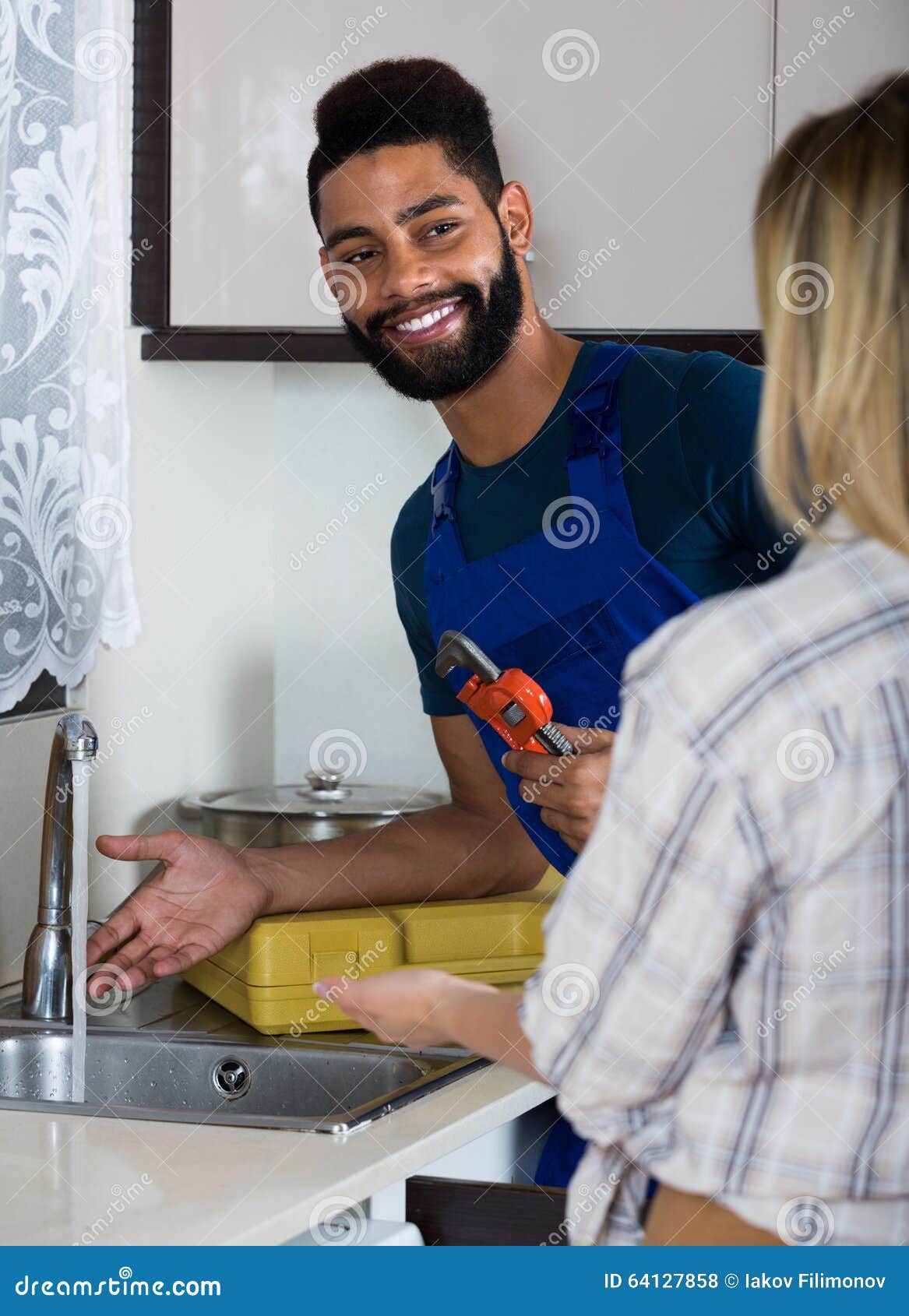 housewife plumber in kitchen