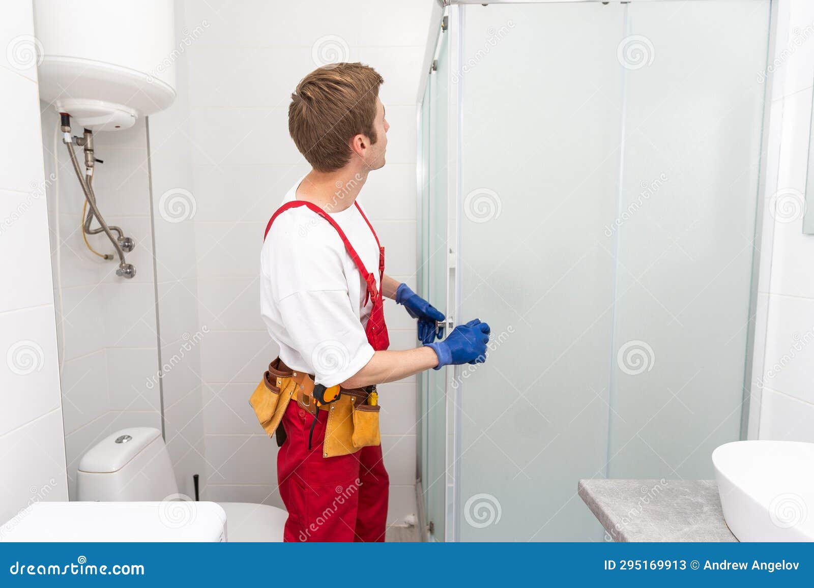 Plumber Installing a Shower Cabin in Bathroom Stock Image Image of