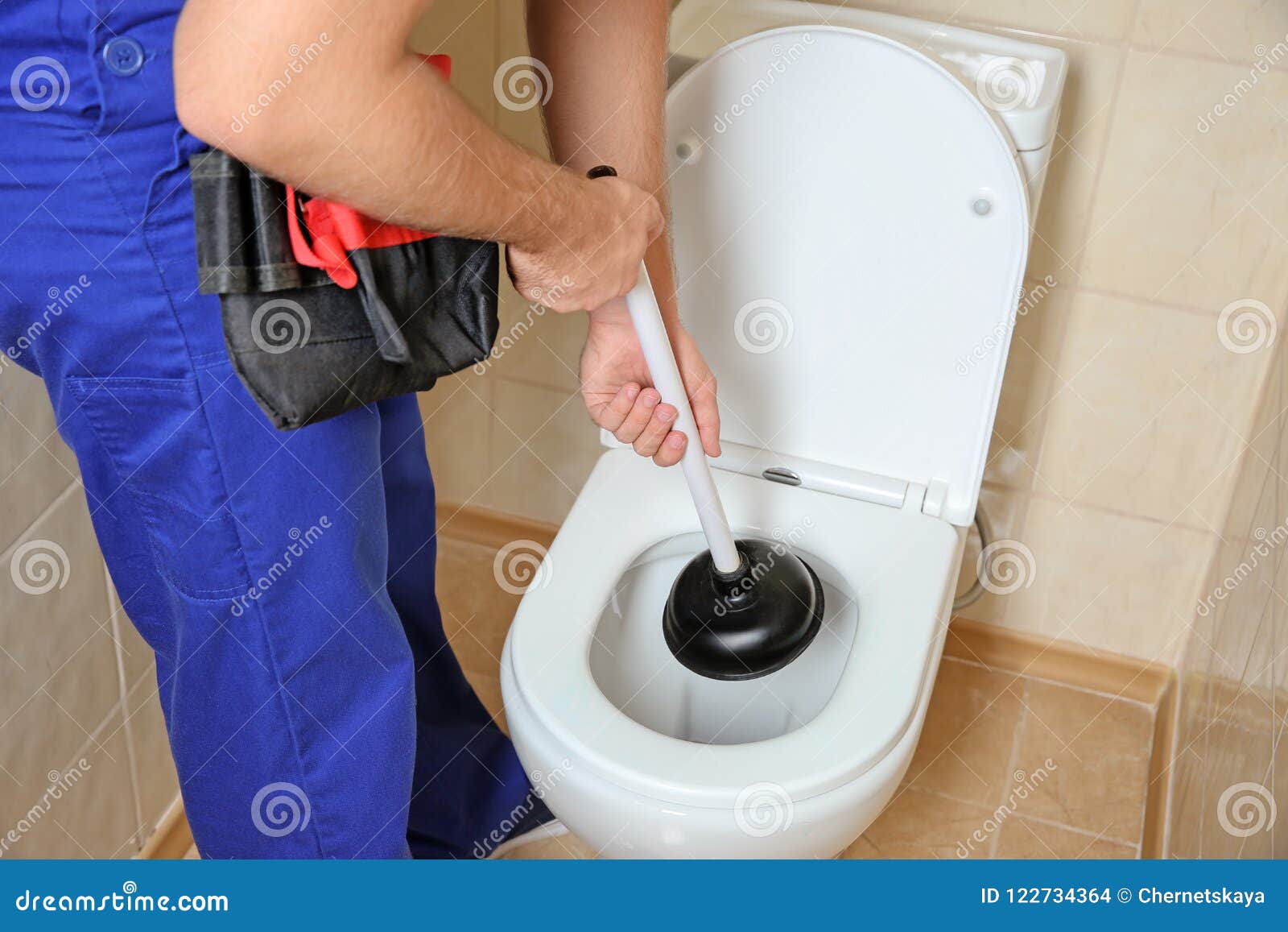 Plunger Inside A Bathroom Toilet High-Res Stock Photo 