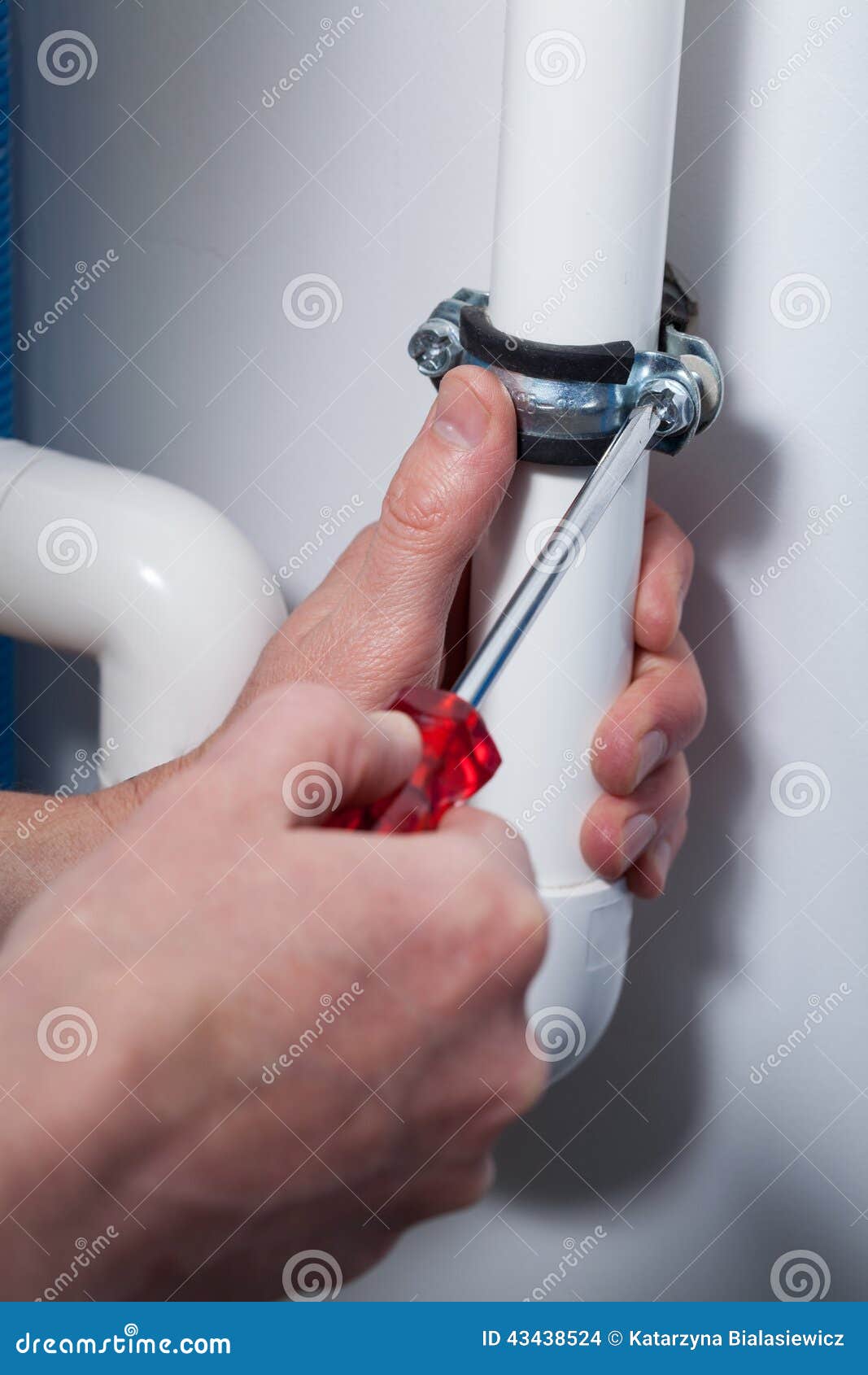 Plumber repairs pipes stock photo. Image of screwdriver 43438524