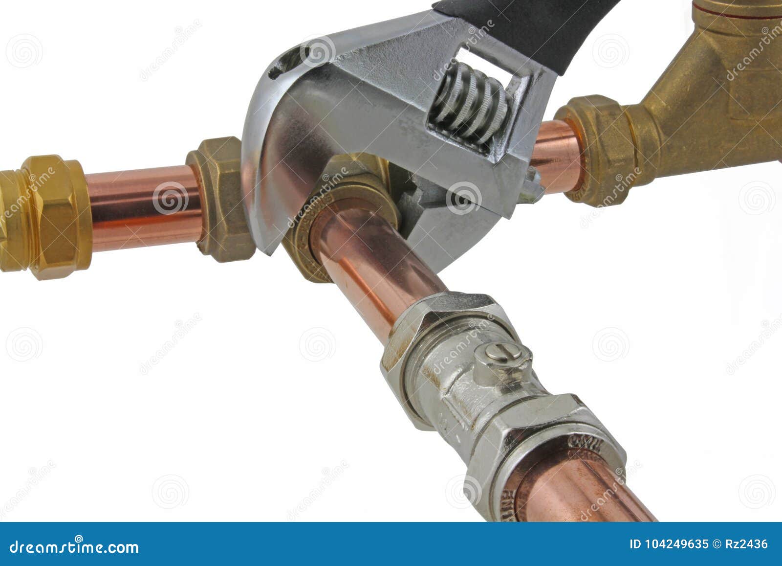 Plumber`s Adjustable Wrench Tightening Up Copper Pipework Stock Image