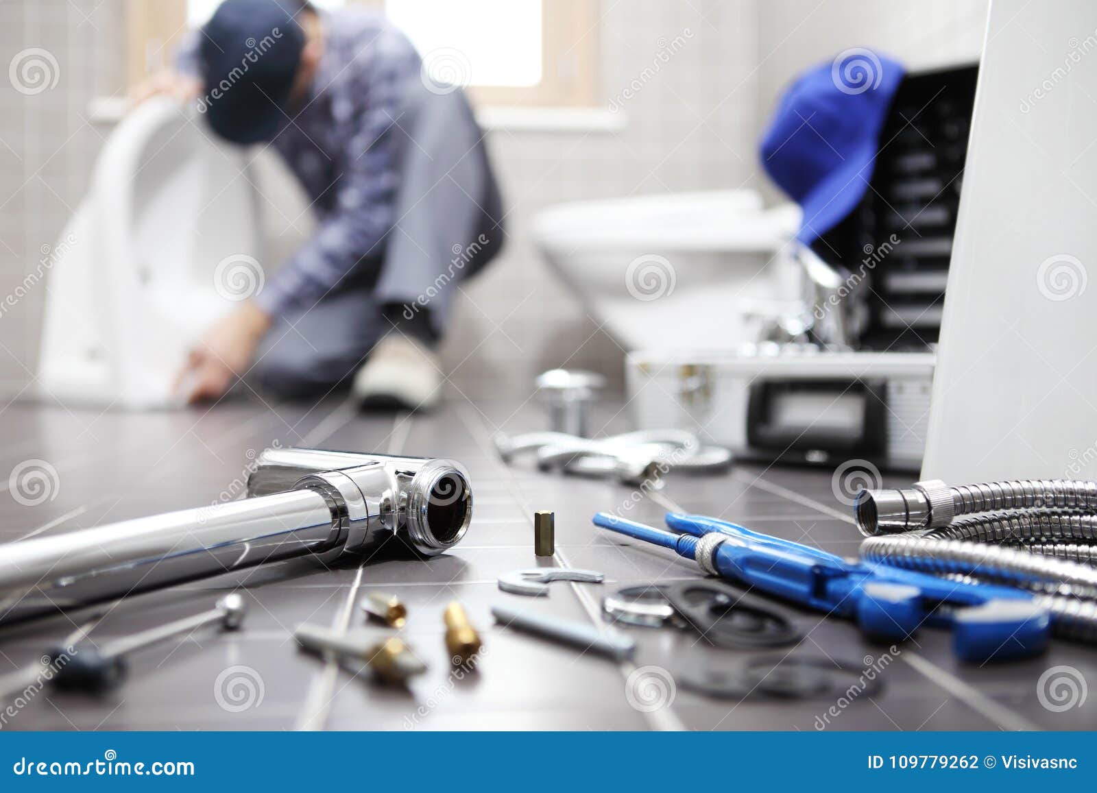 plumber at work in a bathroom, plumbing repair service, assemble