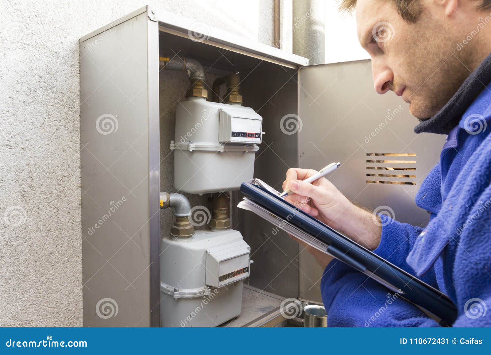 plumber at work making the consumption metering