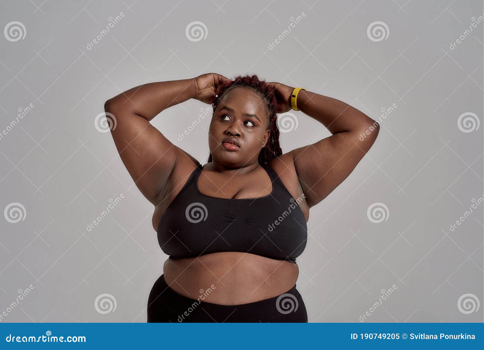 Plump, Plus Size African American Woman in Black Sportswear