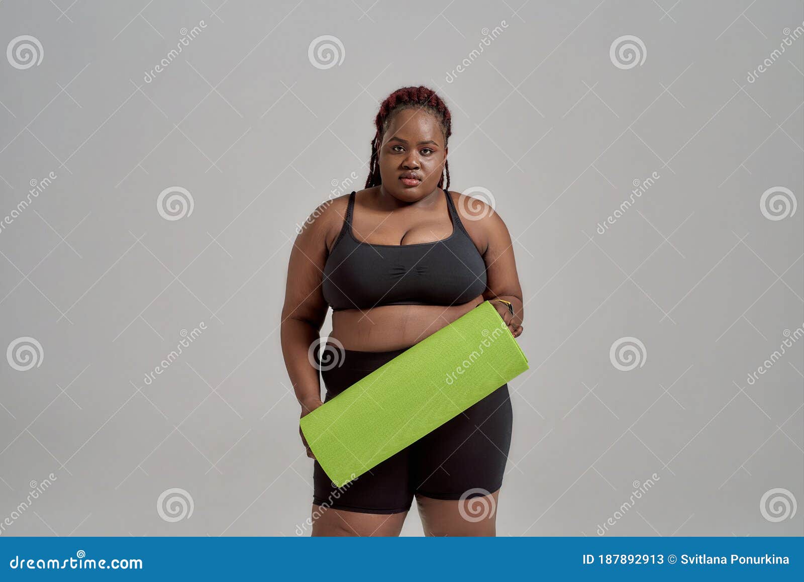 Plump, Plus Size African American Woman in Sportswear Holding Green Yoga Mat  for Fitness, Posing in Studio Over Grey Stock Image - Image of loss,  athlete: 187892913