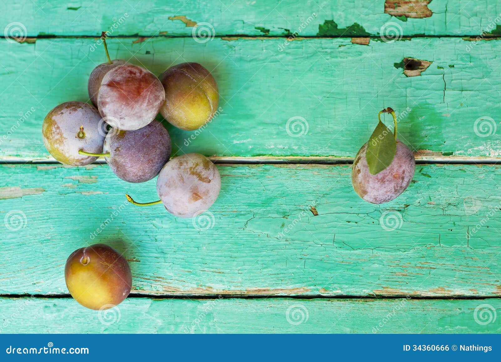 plums on old turquose color surface